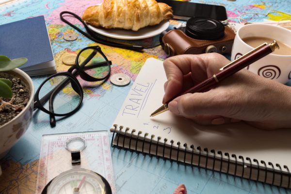 plan-trip-background-what-take-trip-women-s-hands-notepad-writing-ideas-map-retro-camera-money-coins-croissant-coffee-pen-compass-