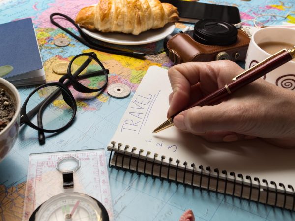 plan-trip-background-what-take-trip-women-s-hands-notepad-writing-ideas-map-retro-camera-money-coins-croissant-coffee-pen-compass-
